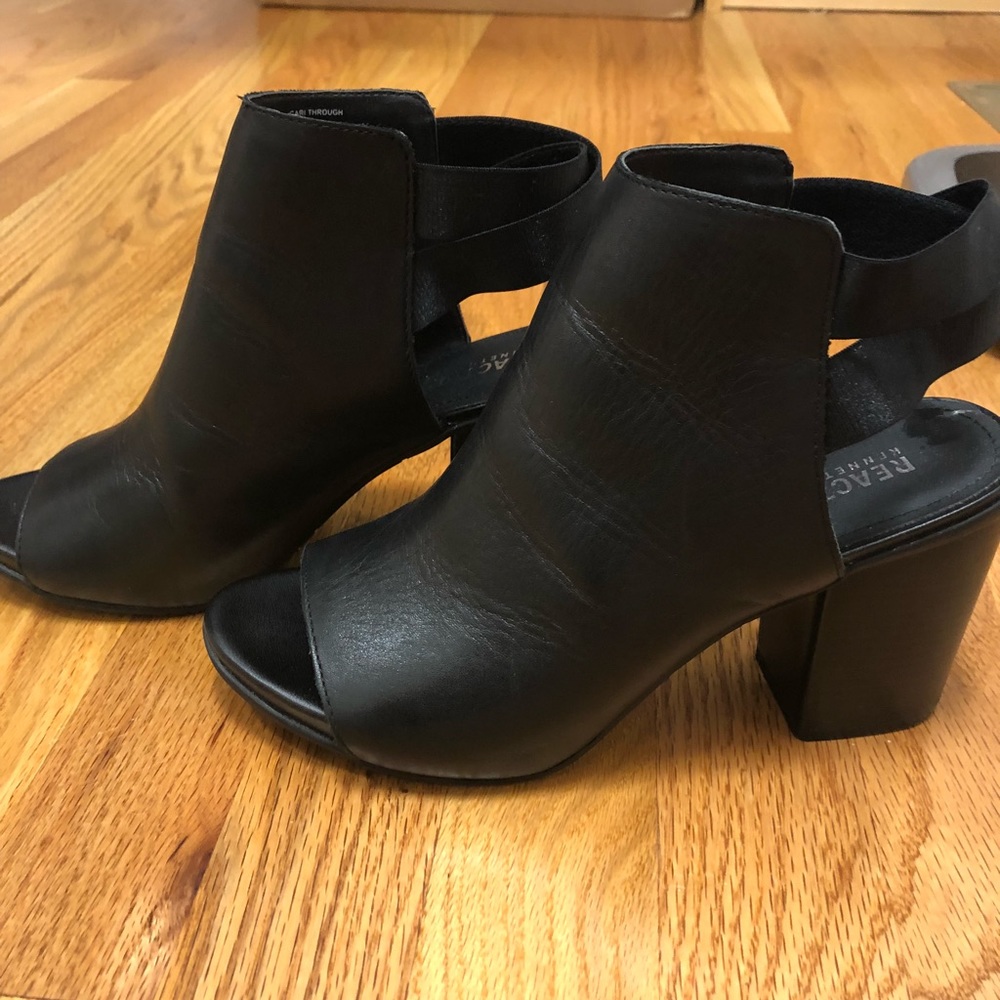 Black leather block heels, with flexible straps.